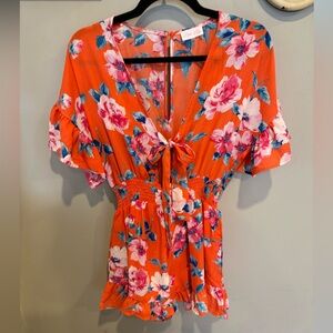 Orange Floral ruffle pink lily romper.